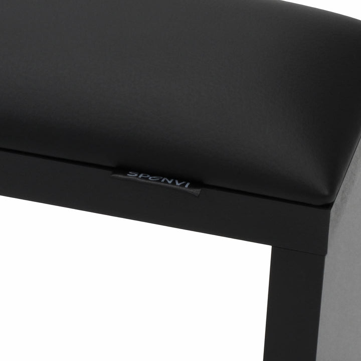 Close-up of SPENVI Classic manicure arm rest with black leather cushion and black-finish wooden base.