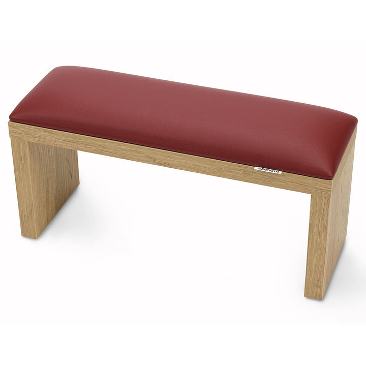 SPENVI Classic manicure arm rest with red leather cushion and oak-finish wooden legs, displayed on a white background. #color_bordo