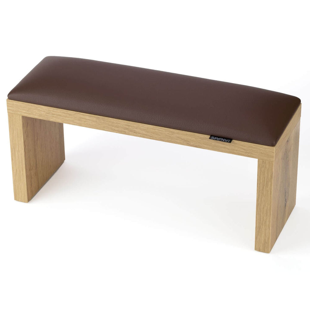 SPENVI Classic manicure arm rest with chocolate leather cushion and oak-finish wooden legs, displayed on a white background. #color_chocolate