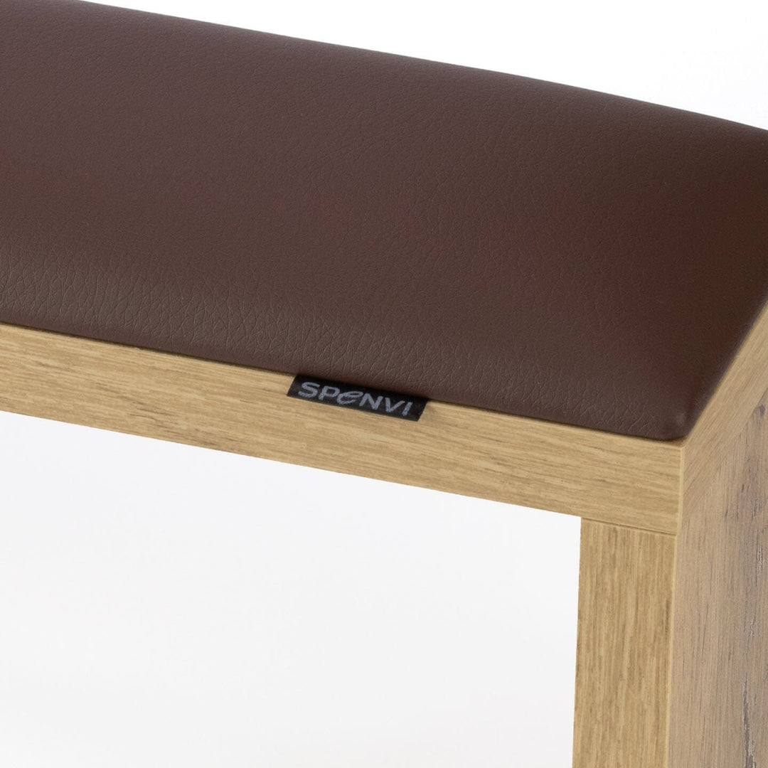 Close-up of SPENVI Classic manicure arm rest with chocolate leather cushion and oak-finish wooden base. #color_chocolate
