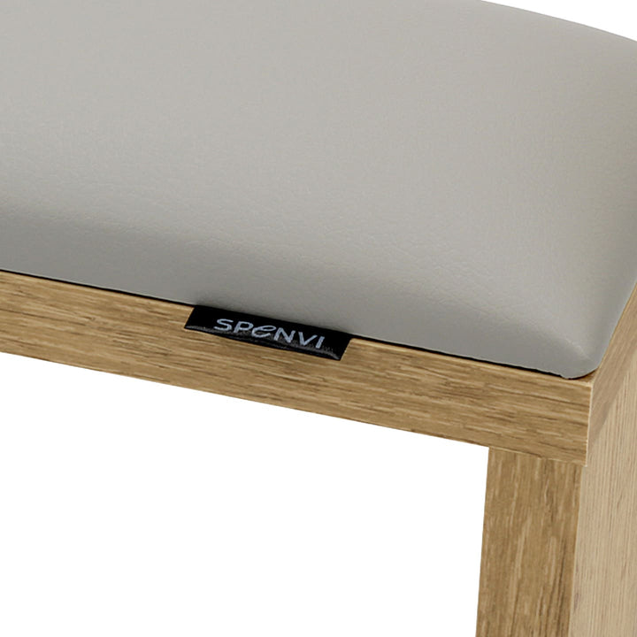Close-up of SPENVI Classic manicure arm rest with light gray leather cushion and oak-finish wooden base. #color_cloud