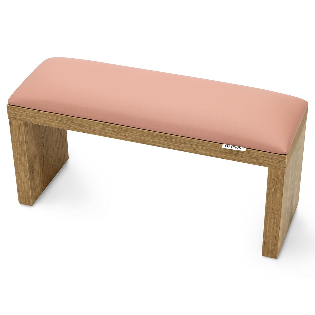 SPENVI Classic manicure arm rest with light pink leather cushion and oak-finish wooden legs, displayed on a white background. #color_light-pink