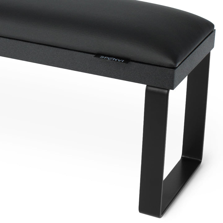 Close-up of SPENVI Loft manicure arm rest with black leather cushion, black metal legs, and black base.