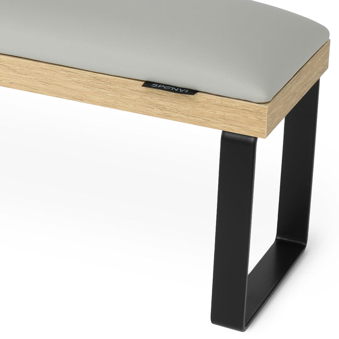 Side view of SPENVI Loft arm rest showing smooth light gray leather cushion, oak-finish base, and black metal legs. #color_cloud