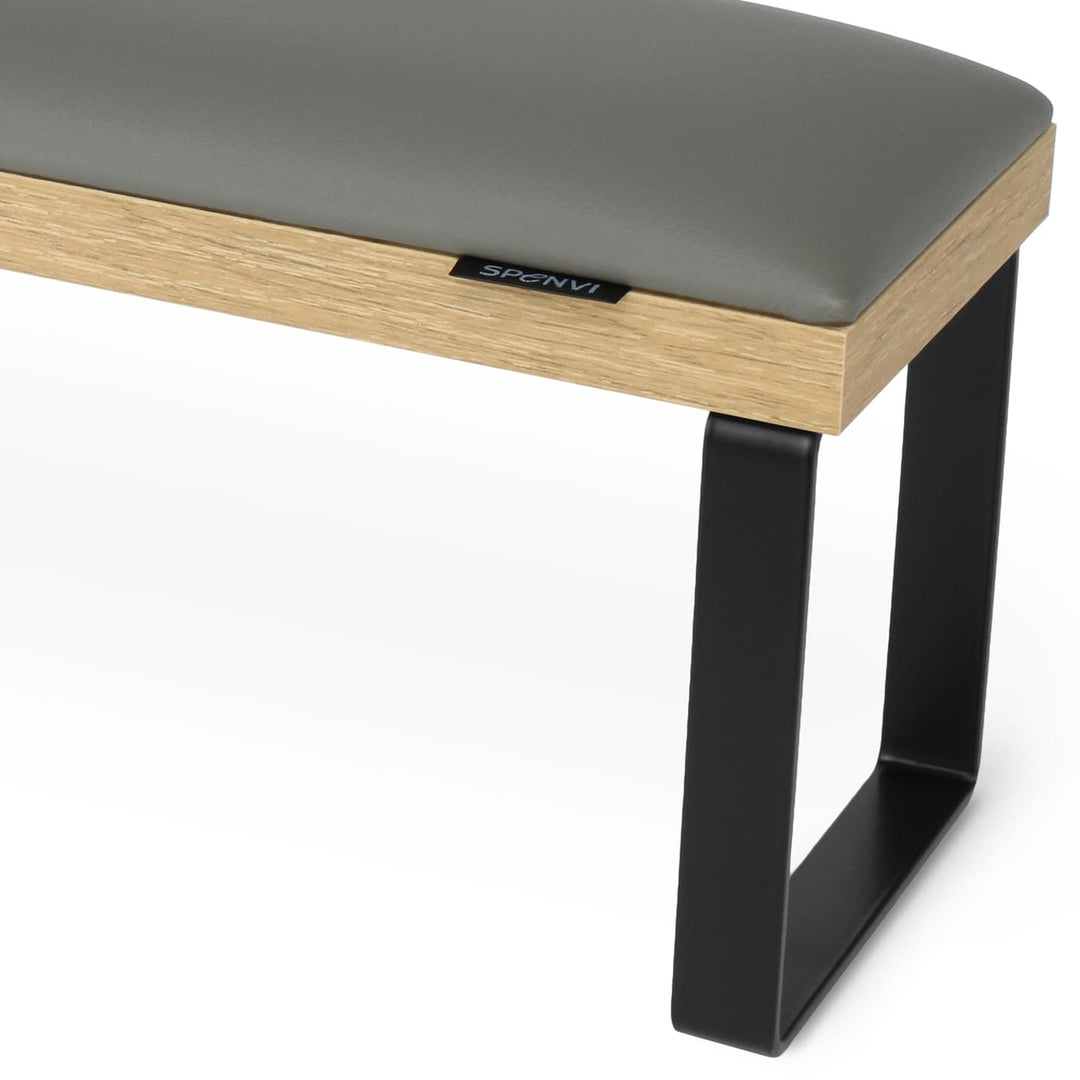 Side view of SPENVI Loft arm rest showing smooth gray leather cushion, oak-finish base, and black metal legs. #color_gray