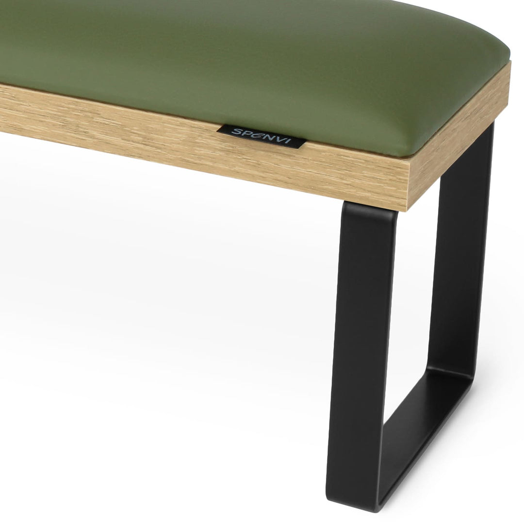 Side view of SPENVI Loft arm rest showing smooth khaki leather cushion, oak-finish base, and black metal legs. #color_khaki