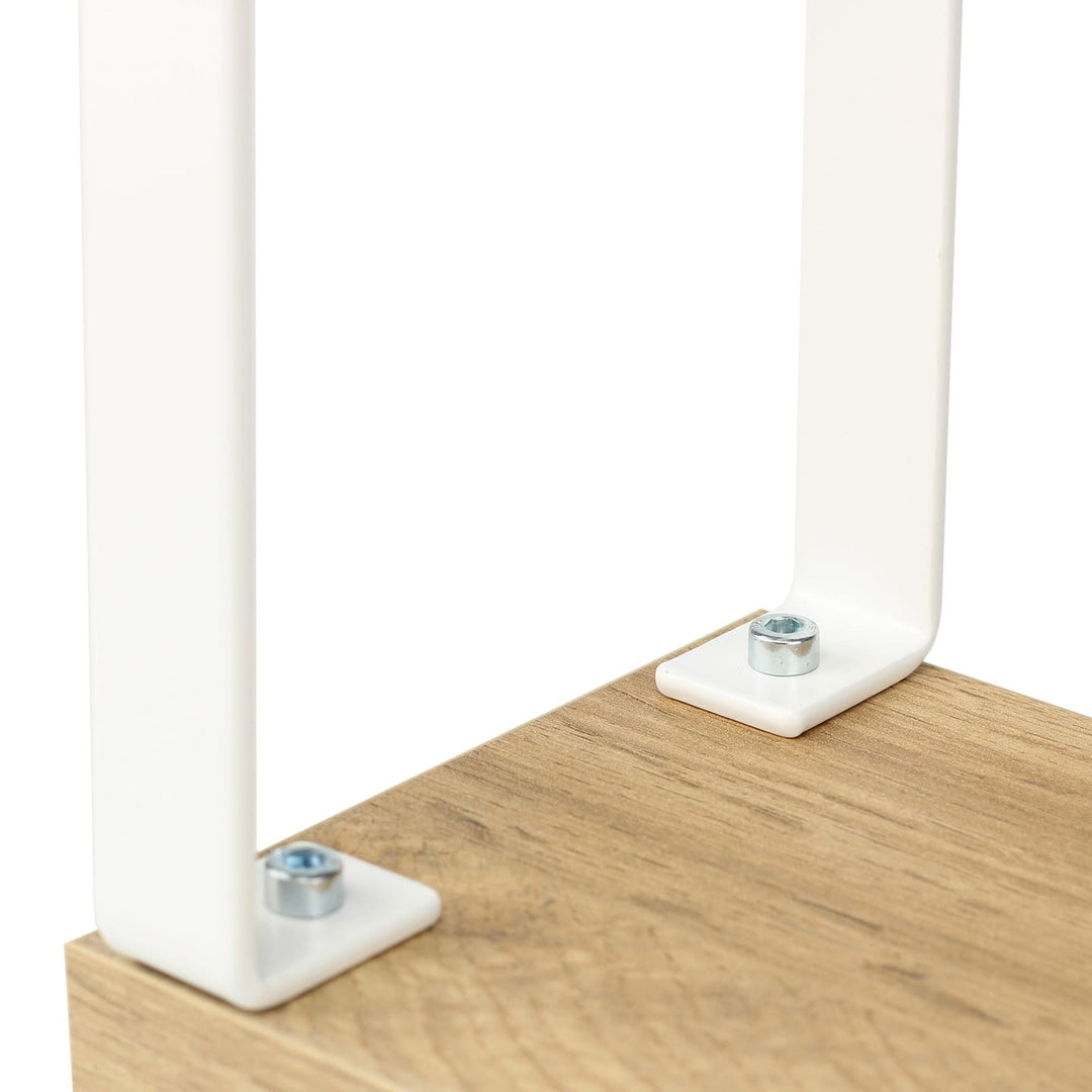 Close-up of SPENVI Loft arm rest showing oak-finish base and white metal leg joints.