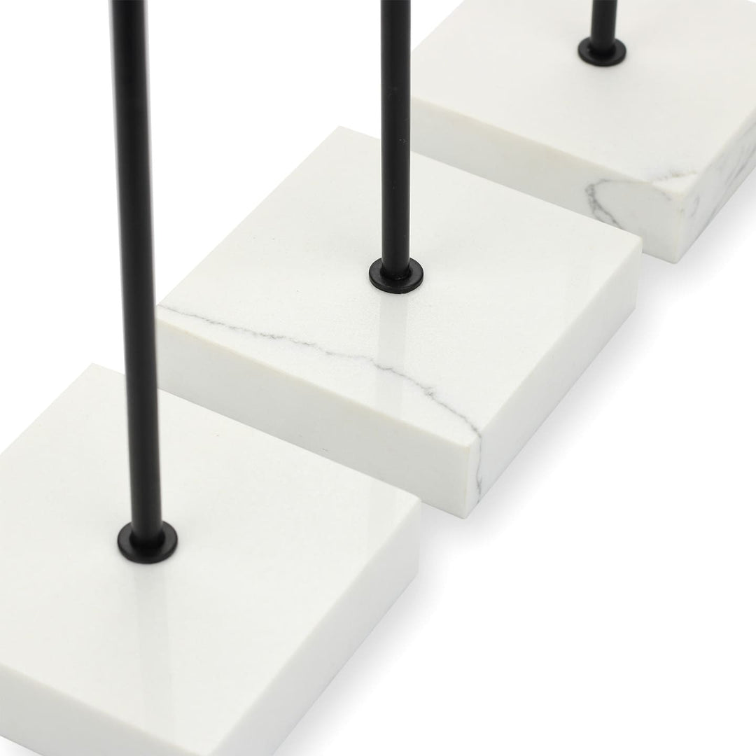 Close-up of SPENVI Nail Swatch Display Stand showing smooth black metal holder and marble base texture. #color_black