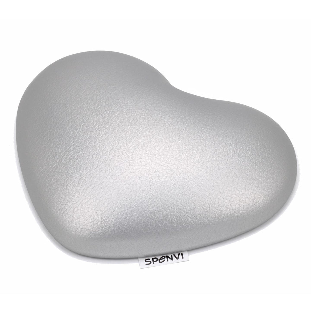 Silver heart-shaped SPENVI nail tech elbow cushion made of soft leather on a clean white background. #color_silver
