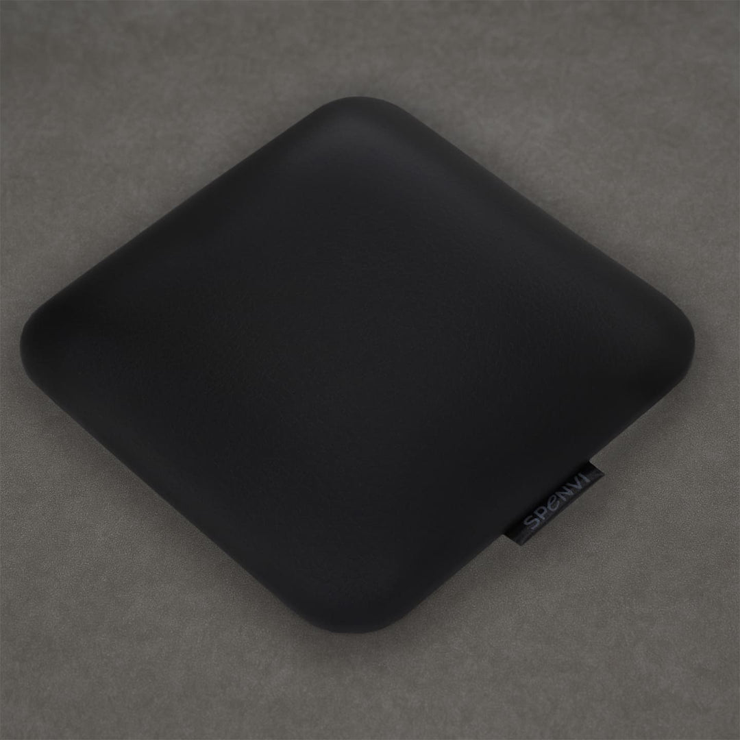 Ergonomic square SPENVI Nail Tech Elbow Cushion Mini Black leather on a grey background, ideal for salon workstations and nail professionals. #color_black