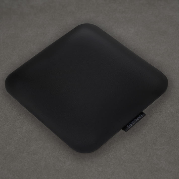 Ergonomic square SPENVI Nail Tech Elbow Cushion Mini Black leather on a grey background, ideal for salon workstations and nail professionals. #color_black