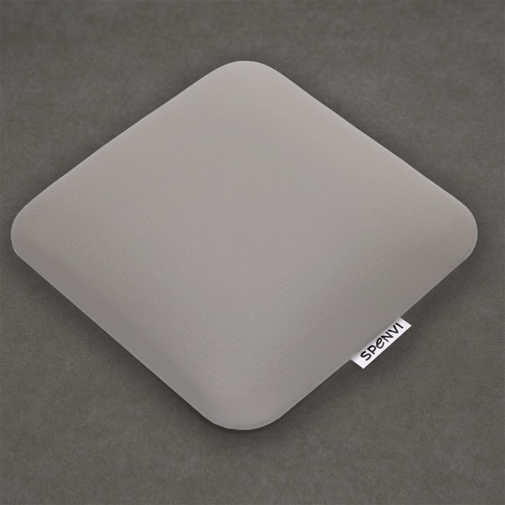 Ergonomic square SPENVI Nail Tech Elbow Cushion Mini light gray leather on a grey background, ideal for salon workstations and nail professionals. #color_cloud