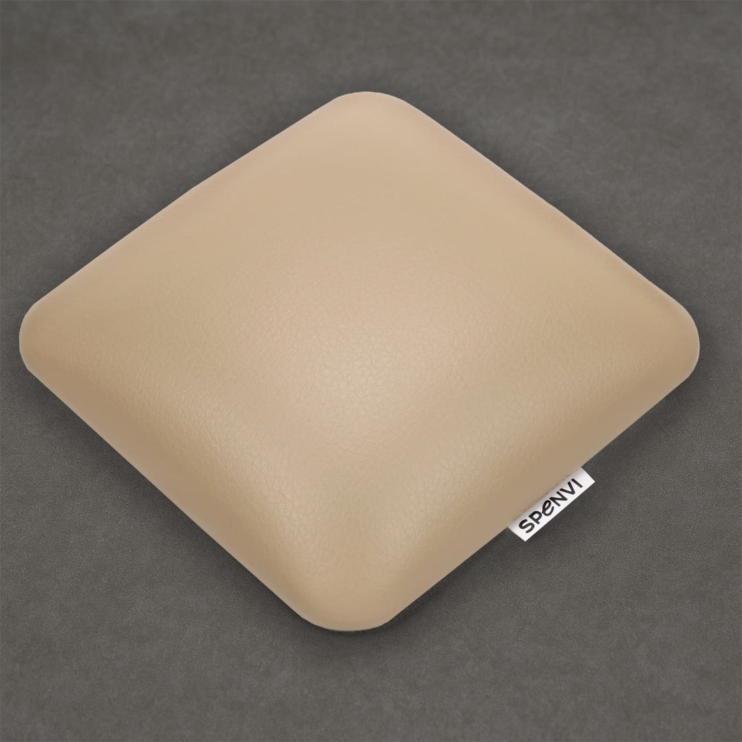 Ergonomic square SPENVI Nail Tech Elbow Cushion Mini beige leather on a grey background, ideal for salon workstations and nail professionals. #color_coffee-milk