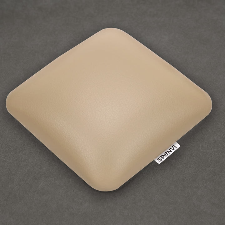 Ergonomic square SPENVI Nail Tech Elbow Cushion Mini beige leather on a grey background, ideal for salon workstations and nail professionals. #color_coffee-milk