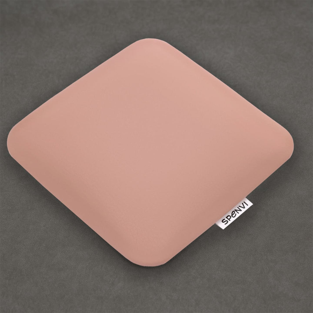 Ergonomic square SPENVI Nail Tech Elbow Cushion Mini Light Pink leather on a grey background, ideal for salon workstations and nail professionals. #color_light-pink