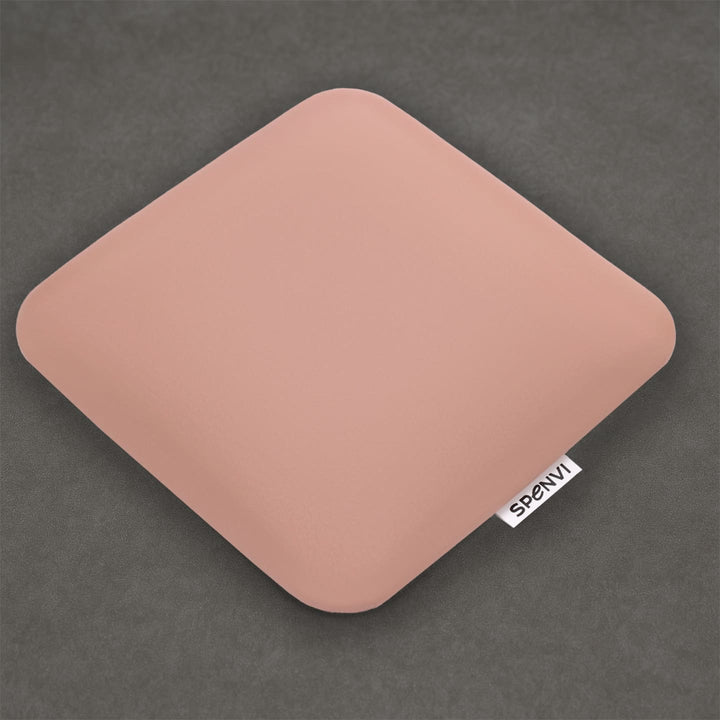 Ergonomic square SPENVI Nail Tech Elbow Cushion Mini Light Pink leather on a grey background, ideal for salon workstations and nail professionals. #color_light-pink