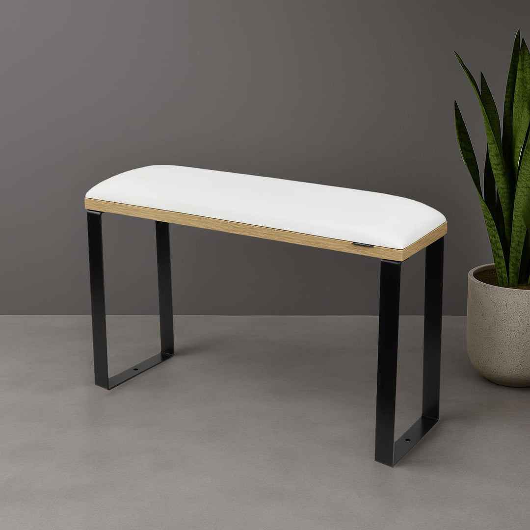 SPENVI Loft pedicure footrest with white leather cushion, oak-finish base, and black metal legs styled in modern salon interior with plant. #color_white