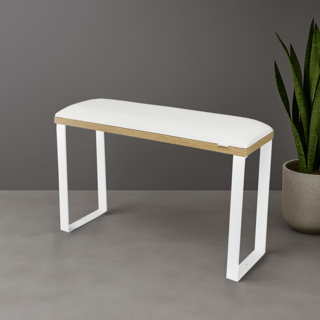 SPENVI Loft pedicure footrest with white leather cushion, oak-finish base, and white metal legs styled in modern salon interior with plant.