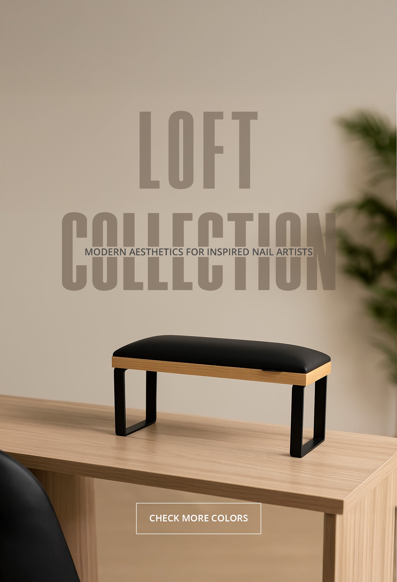 Loft Collection manicure arm rest with black cushion, oak accent frame, and metal legs on a wooden table.